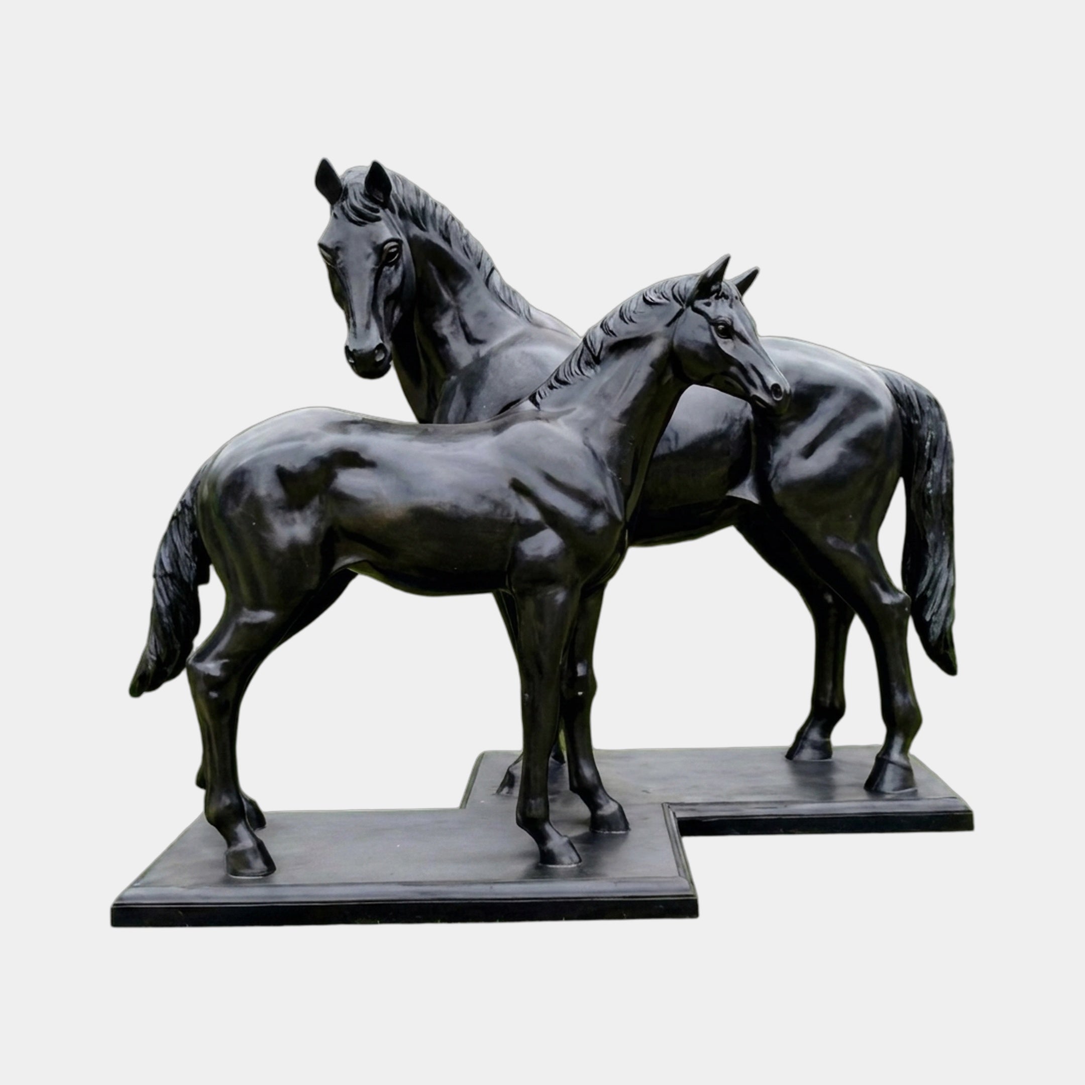 Life-Size Contemporary Horse Bronze Sculpture Pair by Giant Sculptures in high-gloss black patina, standing side by side on rectangular plinths against a plain background.