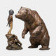 Life-Size Contemporary Rearing Bear and Girl Bronze Sculpture by Giant Sculptures, showing a hooded girl on a rock facing a rearing bear, warm brown patina.
