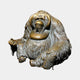 Life-Size Contemporary Seated Orangutan Bronze Sculpture by Giant Sculptures, front view showing golden cheek flanges and dark patinated shaggy fur, on plain background.