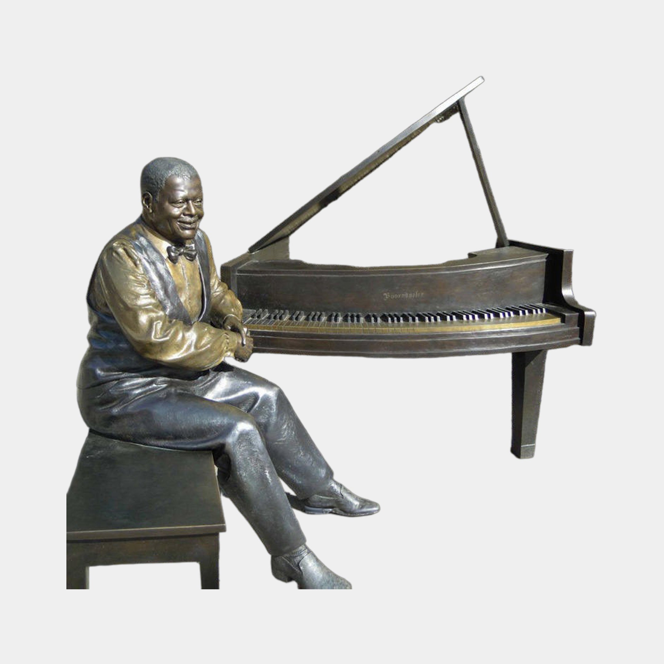 Life-Size Contemporary Seated Pianist and Grand Piano Bronze Sculpture by Giant Sculptures, smiling suited figure with golden-brown and black patina at the keys.
