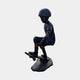Life-Size Contemporary Skateboarding Boy Bronze Sculpture by Giant Sculptures, side view of a helmeted boy crouched mid-trick on a skateboard atop a rocky base.