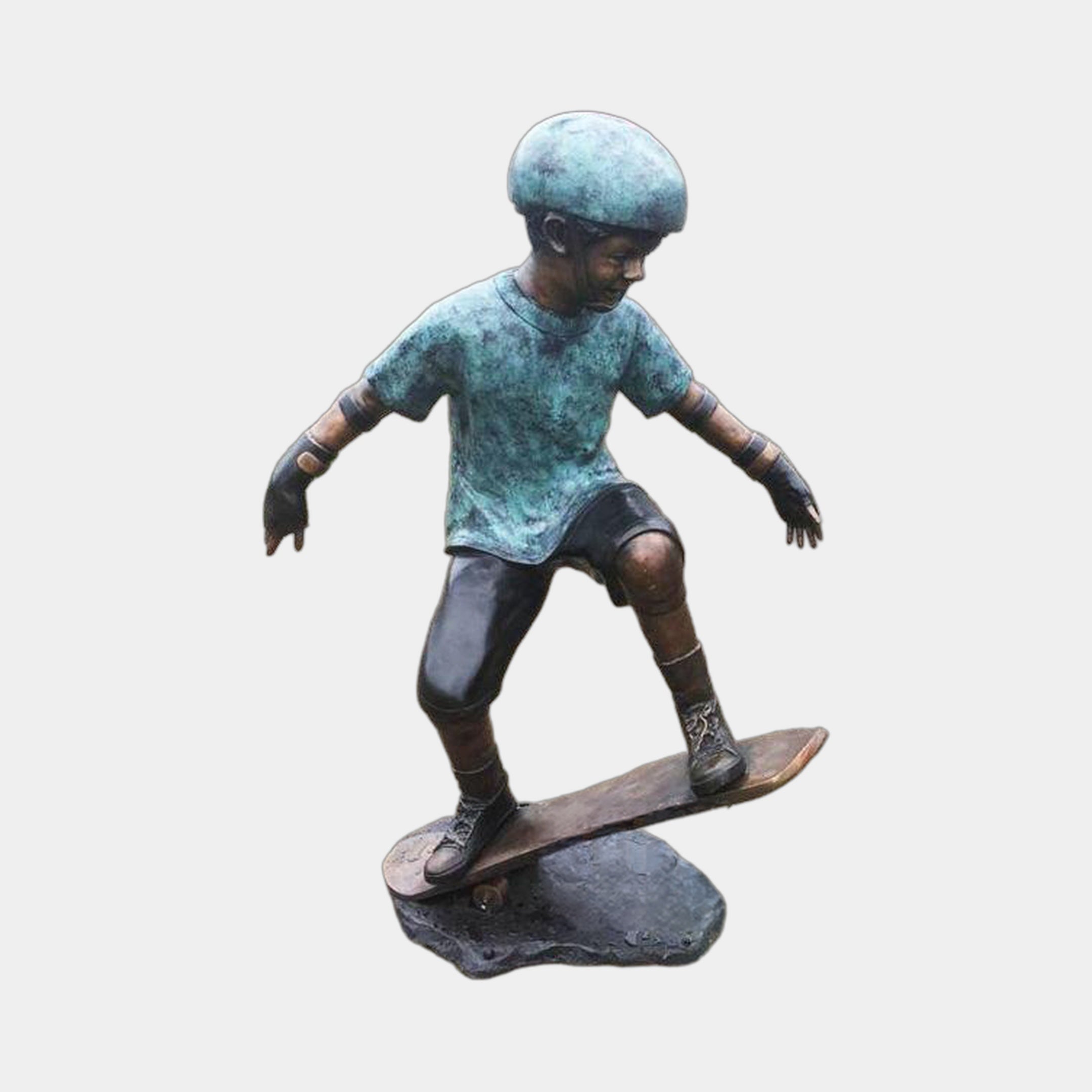 Life-Size Contemporary Skateboarding Boy Bronze Sculpture by Giant Sculptures, 130cm, arms spread mid-ride with teal verdigris helmet and shirt on a plain background.