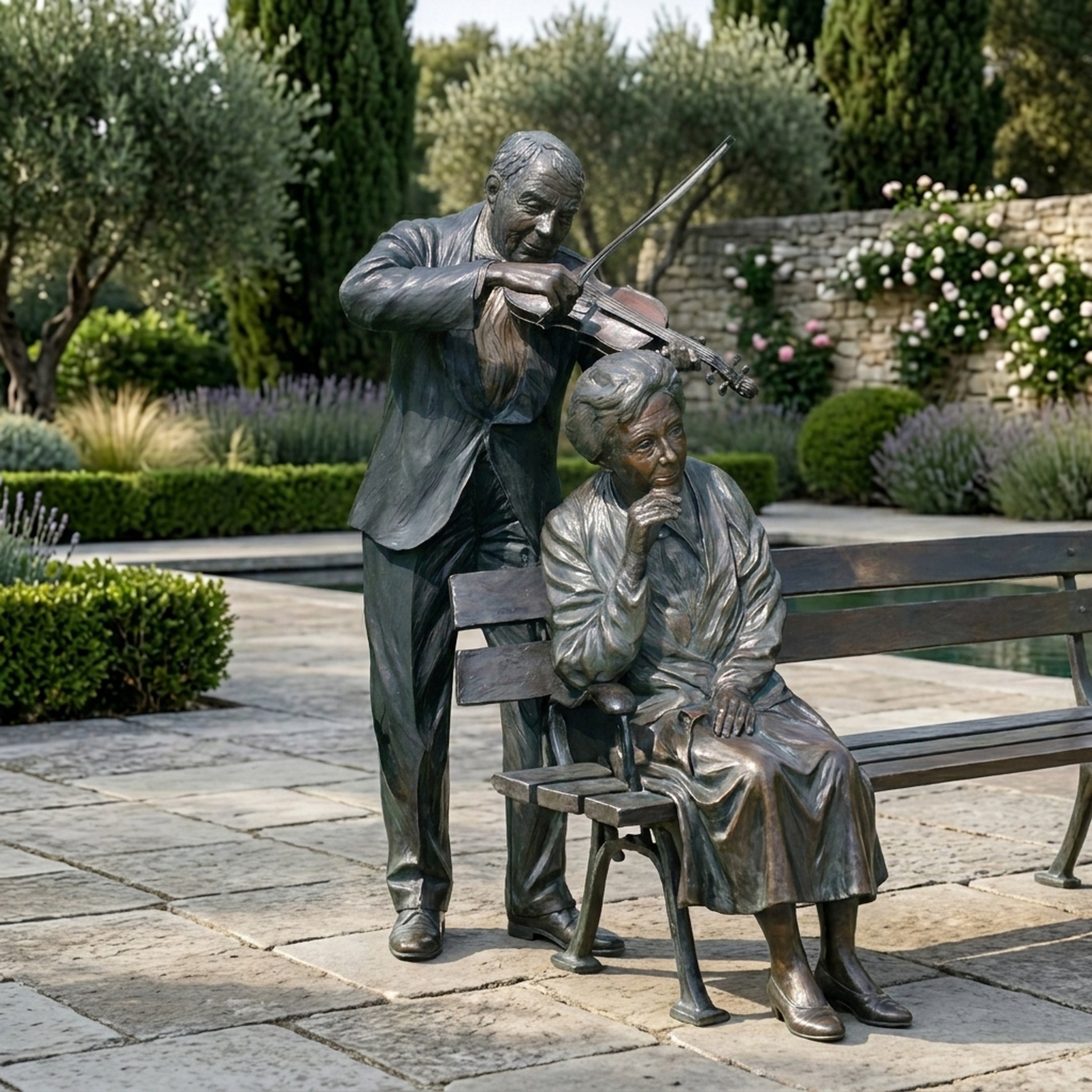 Life-Size Contemporary Violinist and Seated Listener Bronze Sculpture by Giant Sculptures, dark patina figures on a paved garden terrace with lavender beds.