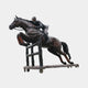 Giant Sculptures Life-Size Jockey and Horse Clearing a Jump Bronze Sculpture 330cm, dark patina with reddish hooves, mid-leap over fence on castor base.