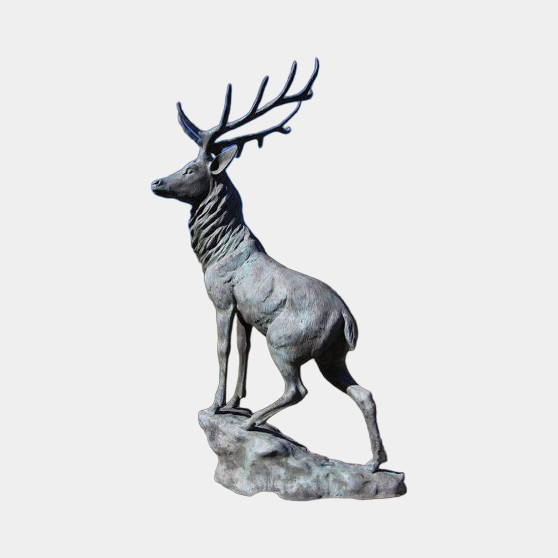 Life-Size Rearing Stag Bronze Sculpture by Giant Sculptures shown in side profile with wide antlers and verdigris patina on a rocky base against a light grey background.