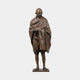 Life-Size Standing Gandhi Figure Bronze Statue by Giant Sculptures, 180cm, shown front-on with bowed head, clasped hands and draped shawl in warm brown patina.