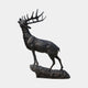 Life-Size Traditional Bugling Bull Elk Bronze Sculpture by Giant Sculptures, 220cm, head raised mid-call with wide antlers, on a rocky base against plain background.