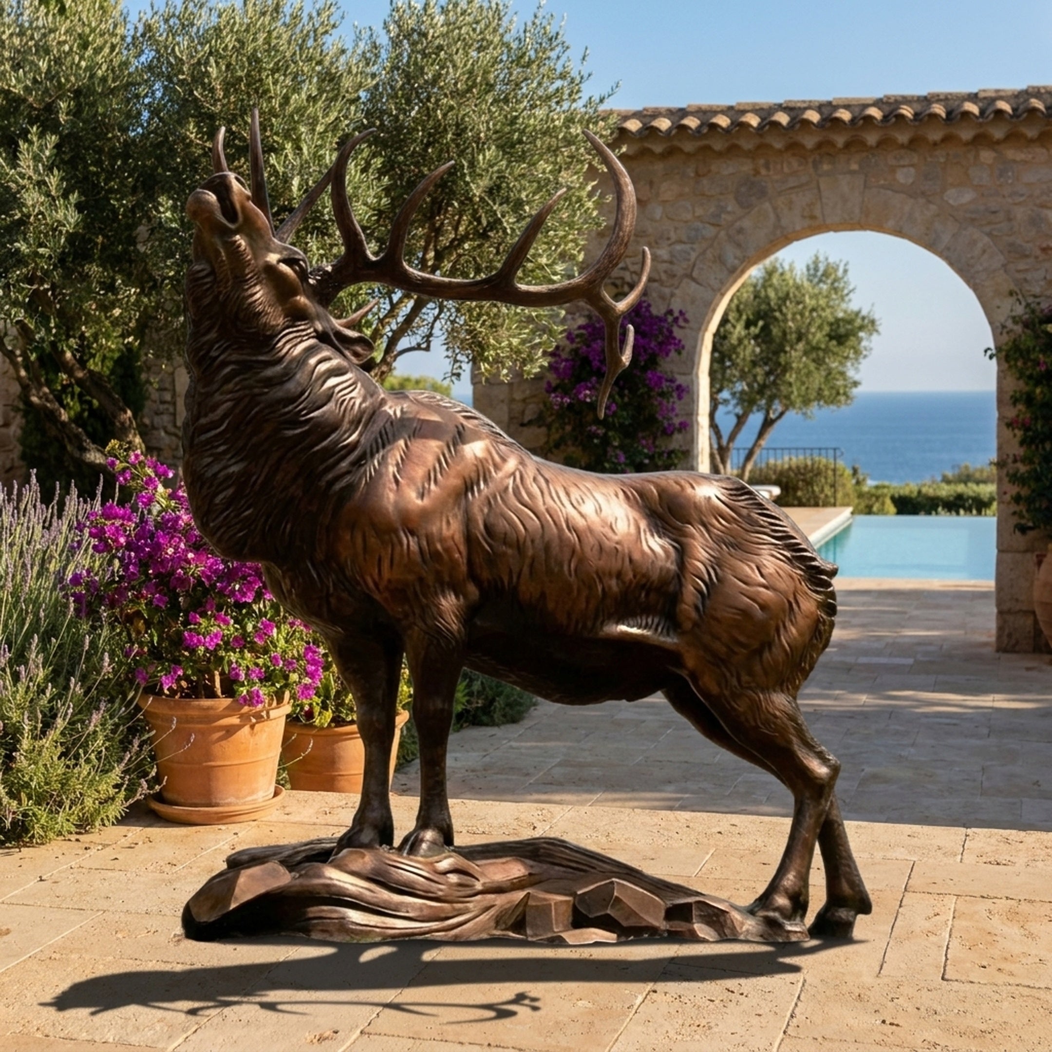 Life-Size Traditional Bugling Elk Stag Bronze Sculpture by Giant Sculptures, head raised mid-call with wide antlers, displayed on a poolside Mediterranean terrace.