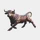 Life-Size Traditional Charging Bull Bronze Sculpture by Giant Sculptures in warm brown patina, shown mid-lunge with raised head and horns on a plain grey background.