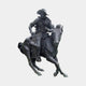 Life-Size Traditional Cowboy Riding Galloping Horse Bronze Sculpture by Giant Sculptures, dark patina rider in wide-brim hat on a horse mid-stride, plain background.