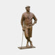 Life-Size Traditional Male Golfer Bronze Sculpture by Giant Sculptures, shown in warm mid-brown patina wearing a flat cap, waistcoat and knickerbockers, leaning on a club.
