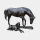 Life-size traditional bronze mare and foal sculpture by Giant Sculptures, the mare standing with head lowered over the recumbent foal on a rectangular base.