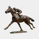 Life-Size Traditional Racing Horse and Jockey Bronze Sculpture 180cm from Giant Sculptures, shown in side view at full gallop with crouched jockey on a stone base.