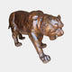 Life-Size Traditional Stalking Tiger Bronze Sculpture by Giant Sculptures, 150cm, shown in a crouched snarl with reddish-brown patina and black stripes on white.