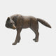 Life-Size Traditional Stalking Wolf Bronze Sculpture by Giant Sculptures in antique brown patina, shown mid-prowl with head lowered and tail raised, on a plain background.