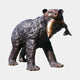 Life-Size Traditional Walking Bear Bronze Sculpture by Giant Sculptures, shown mid-stride with a salmon in its jaws and a dark brown patina against a plain background.