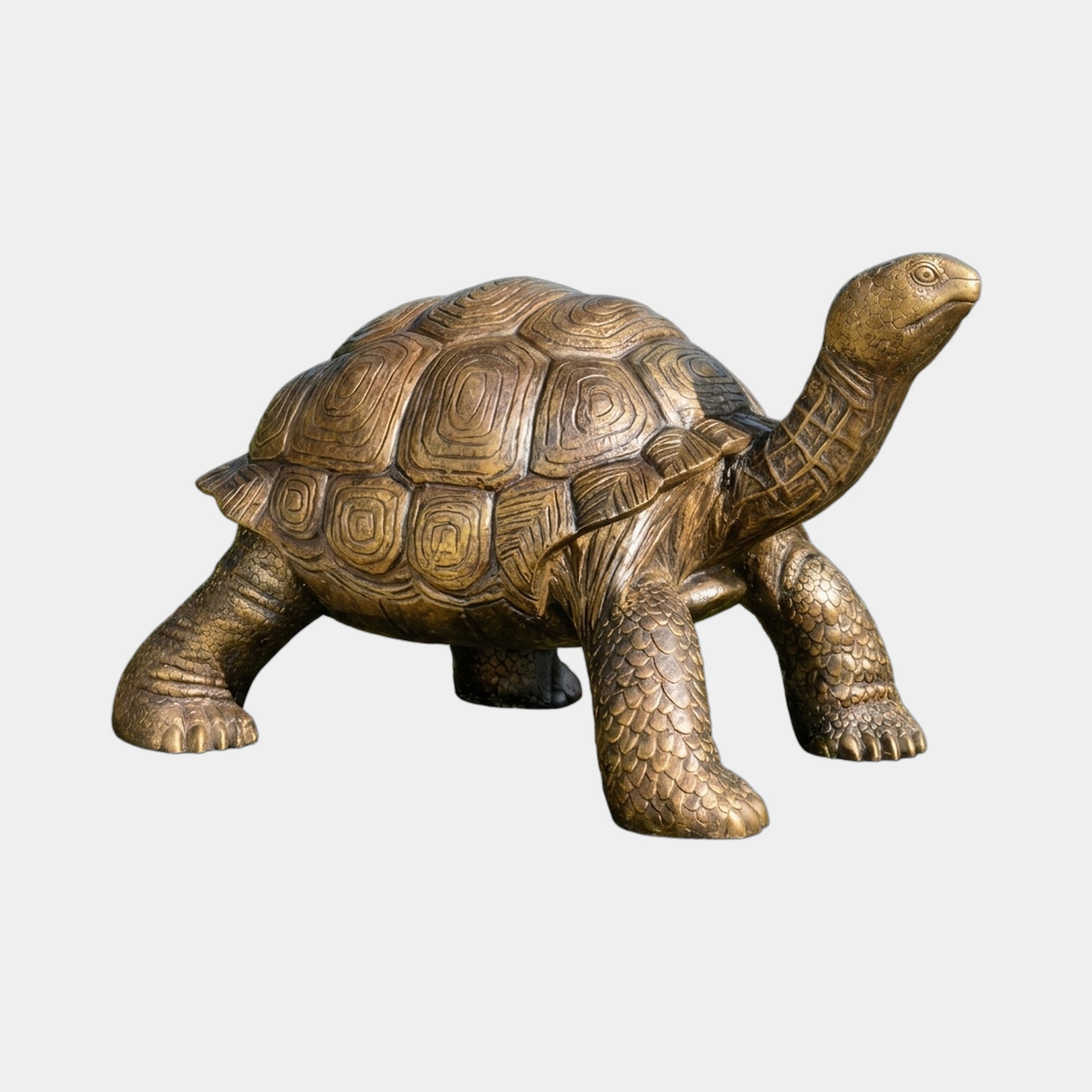 Life-Size Traditional Walking Tortoise Bronze Sculpture by Giant Sculptures in golden-brown patina, shown mid-stride with head raised, on a plain light background.
