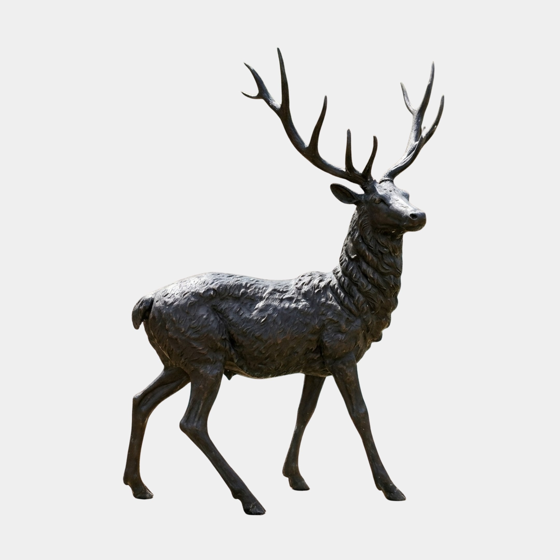 Life-Size Walking Stag Bronze Sculpture by Giant Sculptures, 250cm, shown in side profile mid-stride with raised head and tall multi-point antlers, dark patina.