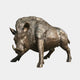 Life-Size Wild Boar Bronze Sculpture by Giant Sculptures shown in a forward-charging stance with lowered head, tusks out, and bristled ridge, on a plain background.