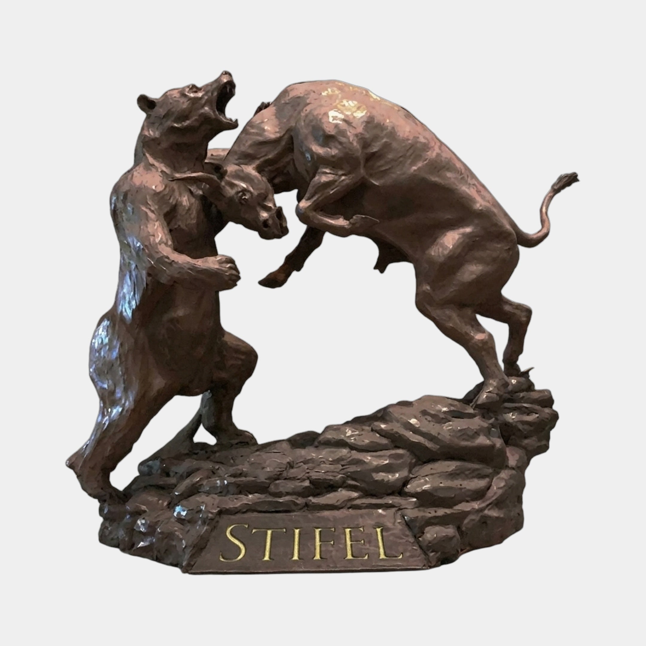 Monumental Bull and Bear Combat Bronze Sculpture by Giant Sculptures, showing both animals rearing in combat on a rocky base with gilded "STIFEL" lettering.