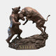 Monumental Bull and Bear Combat Bronze Sculpture by Giant Sculptures, showing both animals rearing in combat on a rocky base with gilded "STIFEL" lettering.