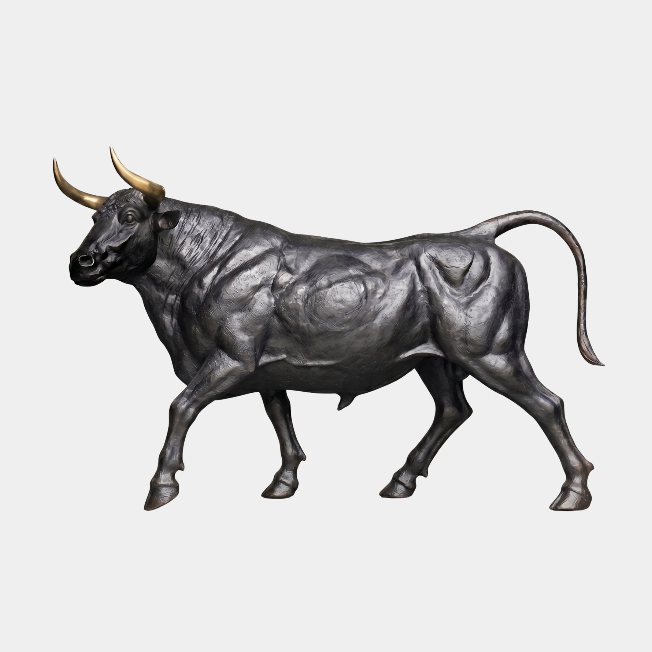 Monumental Charging Bull Bronze Sculpture by Giant Sculptures, 200cm, side view with black patina body, polished gold horns, and arched tail on plain background.
