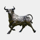 Giant Sculptures Monumental Charging Bull Bronze Sculpture, 220cm, shown in mid-charge with lowered horns and curled tail, dark patinated finish, on a plain background.