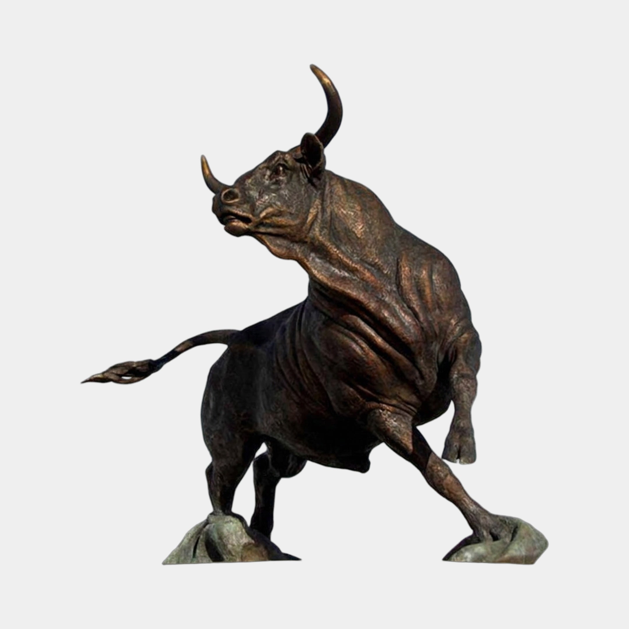 Monumental Charging Bull Bronze Sculpture by Giant Sculptures shown mid-charge with raised horns, brown-to-black patina gradient, on a plain light background.