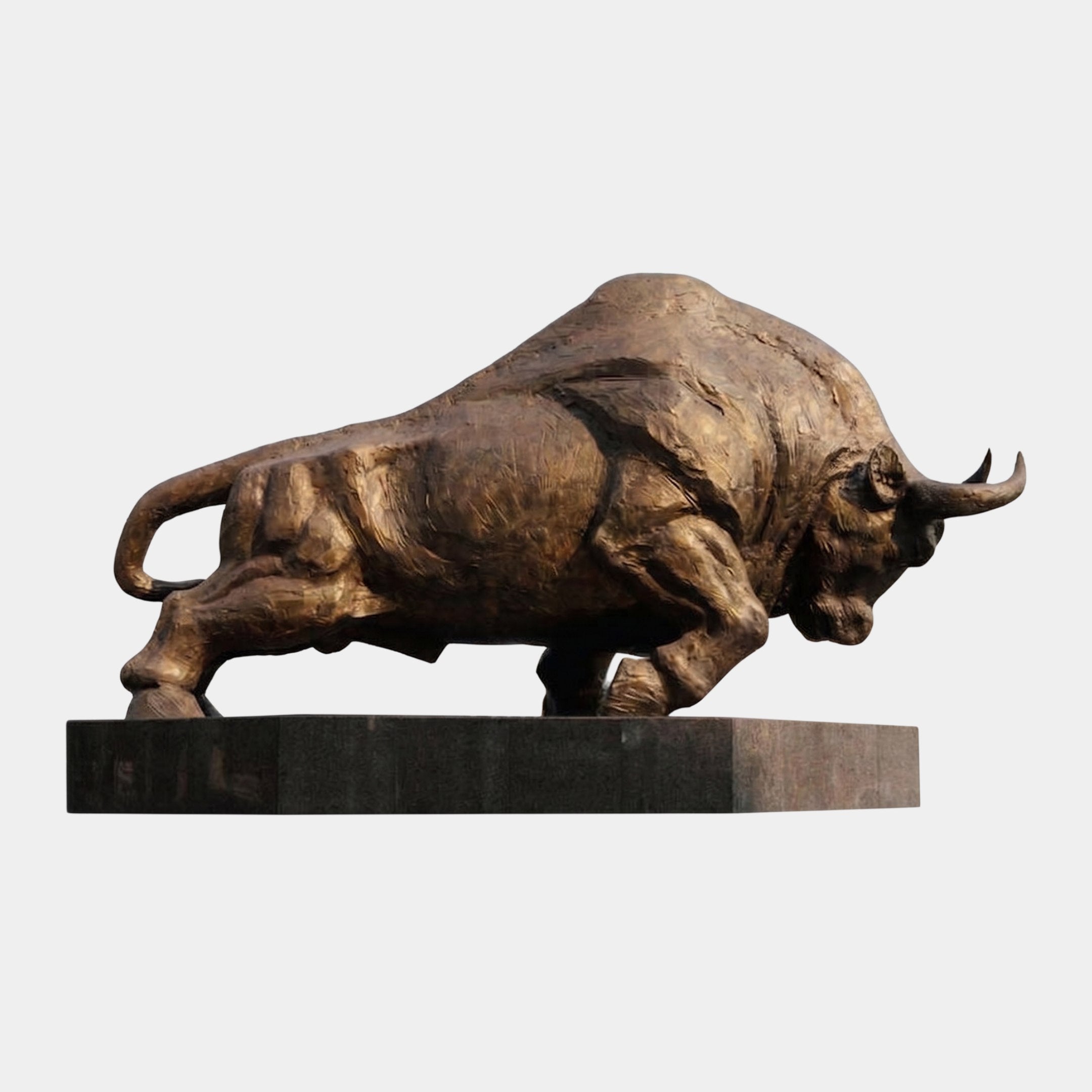 Giant Sculptures Monumental Charging Bull Bronze Sculpture 320cm shown in side view with lowered head and horns forward on a dark granite plinth.