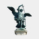 Monumental Classical Archangel Michael Bronze Sculpture by Giant Sculptures with verdigris patina, raised sword, spread wings, on a pale octagonal stone plinth.