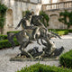 Giant Sculptures Monumental Classical Armoured Warrior and Dragon Bronze Sculpture 280cm, helmeted rider on rearing horse over dragon, in a stone courtyard garden.