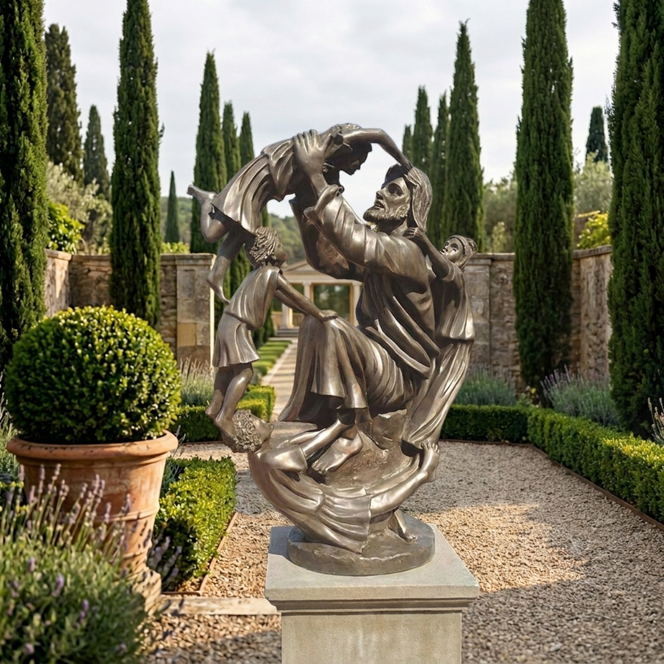 Monumental Classical Bearded Figure with Children Bronze Sculpture by Giant Sculptures on a stone plinth in a formal garden lined with cypress trees.