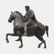 Giant Sculptures Monumental Classical Bearded Rider and Horse Bronze Sculpture 430cm, dark patinated robed figure on a striding horse, side view on plain background.