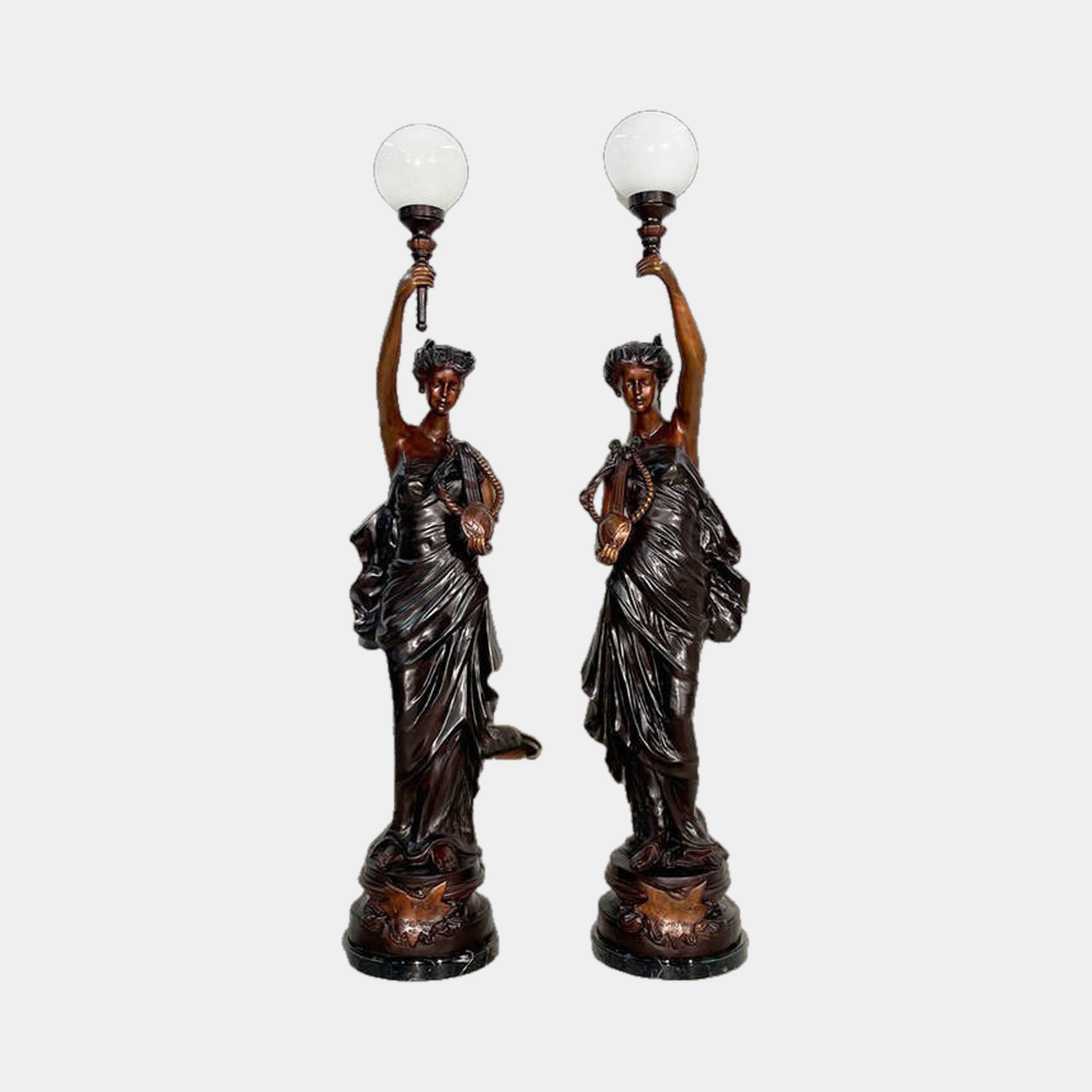 Pair of Monumental Classical Goddess Torchiere Bronze Sculptures by Giant Sculptures, draped figures raising torch lamps with white globe shades, on marble bases.