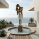 Monumental Classical Goddess with Draped Cloth Bronze Fountain by Giant Sculptures, set in a round basin on an oceanfront terrace with succulents.