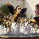 Giant Sculptures Monumental Classical Pegasus Winged Horses Bronze Fountain in polished golden tone, rearing central figure with wings spread above cascading water jets.
