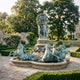 Monumental Classical Rearing Horses and Globe Fountain by Giant Sculptures in verdigris bronze, with figures bearing an armillary sphere above rearing horses in a formal garden.
