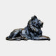 Monumental Classical Recumbent Lion Bronze Sculpture by Giant Sculptures, shown in profile with head turned, flowing mane and dark patina on a plain background.