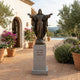 Monumental Classical Sacred Heart Jesus Bronze Statue by Giant Sculptures on a granite pedestal inscribed "Venite Ad Me Omnes" in a Mediterranean courtyard.