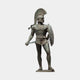 Monumental Classical Spartan Warrior Bronze Statue by Giant Sculptures, 300cm figure in crested helmet with shield and lowered sword, verdigris patina, plain background.