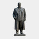 Giant Sculptures 400cm Monumental Classical Standing Military Figure Bronze Statue in a long overcoat with dark patina, on a granite base, plain background.