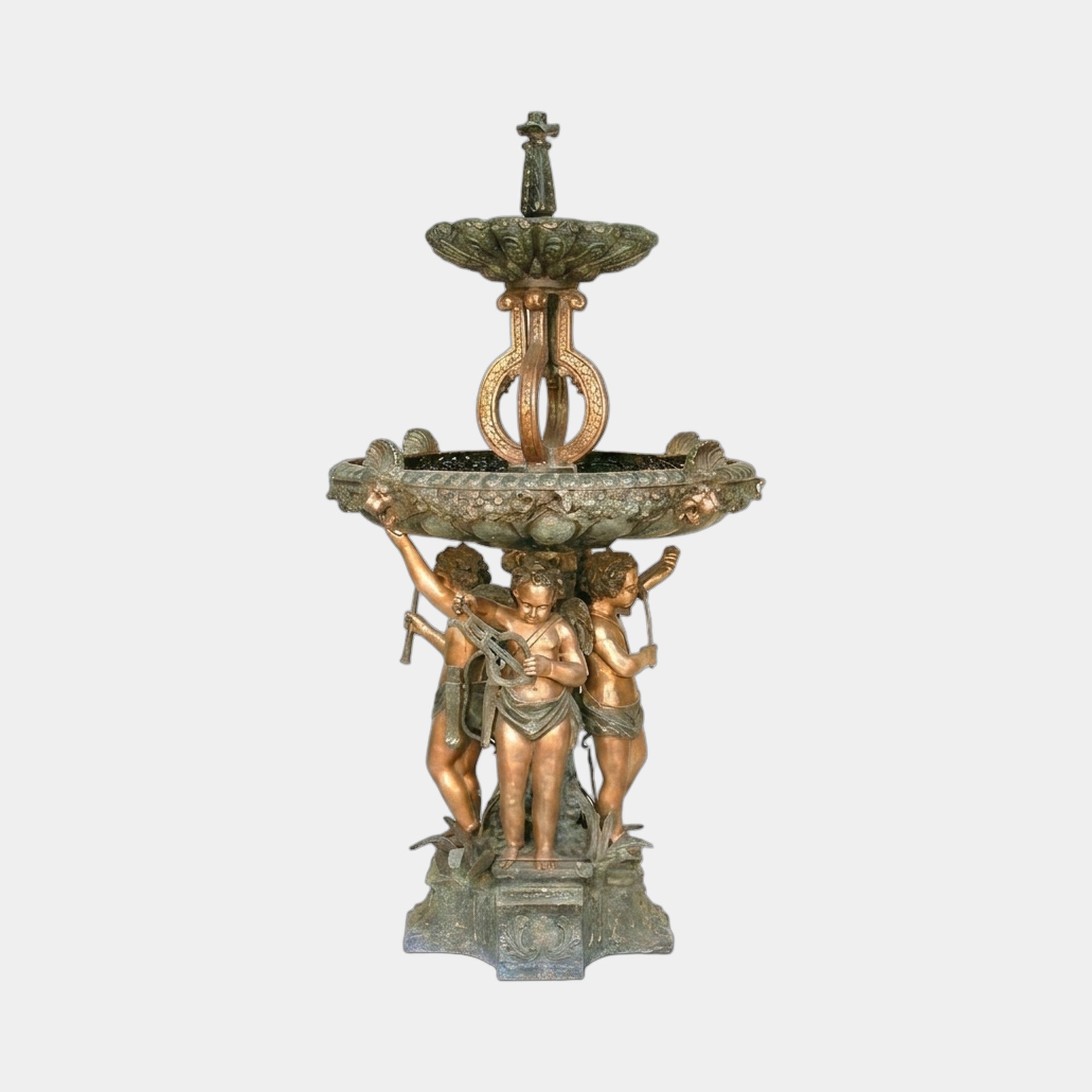 Monumental Classical Three Cherubs Fountain by Giant Sculptures in golden-bronze with verdigris patina, twin tiered basins above three putti, shown on plain background.
