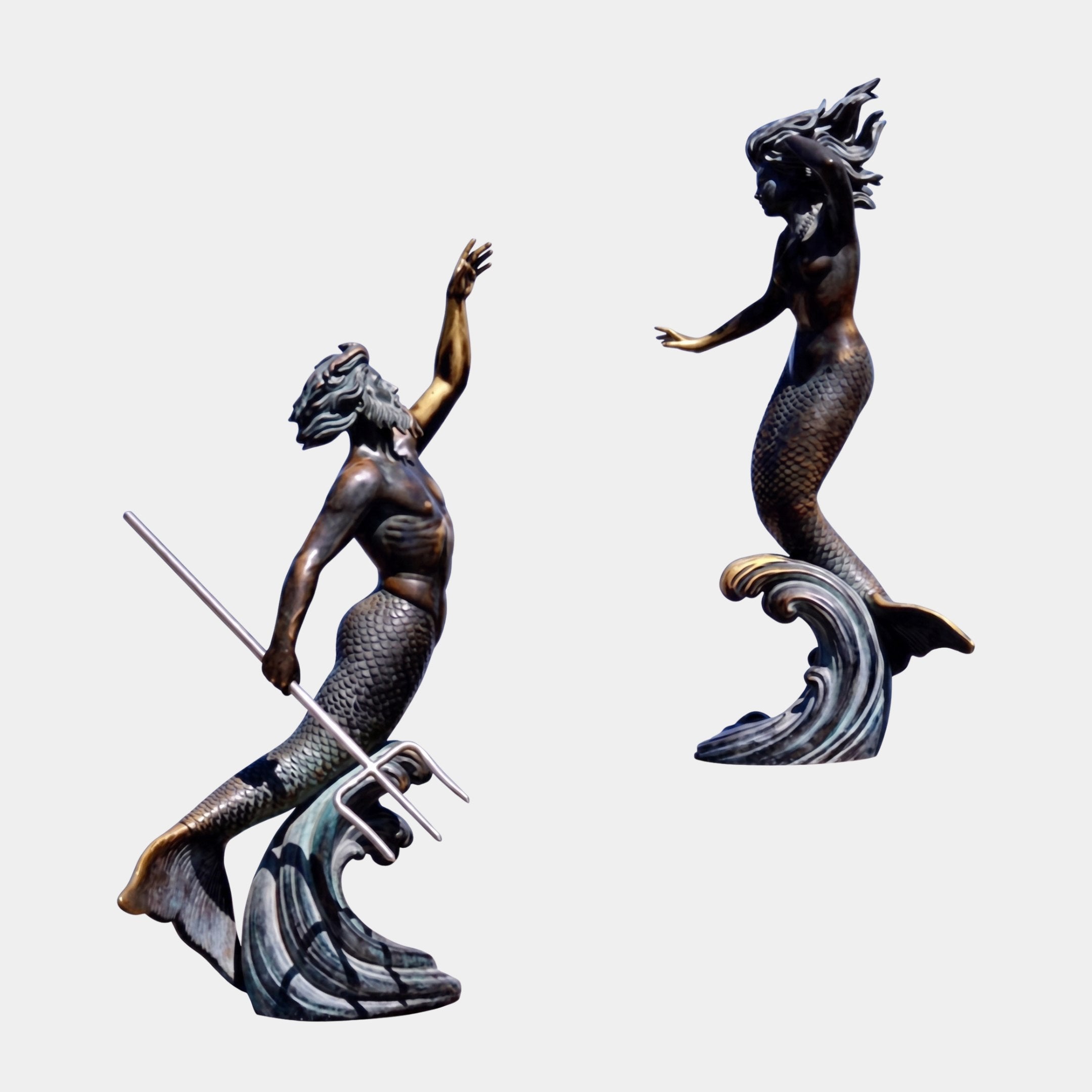 Monumental Classical Triton and Mermaid Bronze Sculpture by Giant Sculptures, bearded Triton with trident and mermaid on wave bases, antique patina, white background.