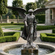 Giant Sculptures Monumental Classical Winged Angel Bronze Fountain in weathered grey-green patina, striding atop a rock base in a formal hedged garden with stone pavilion.