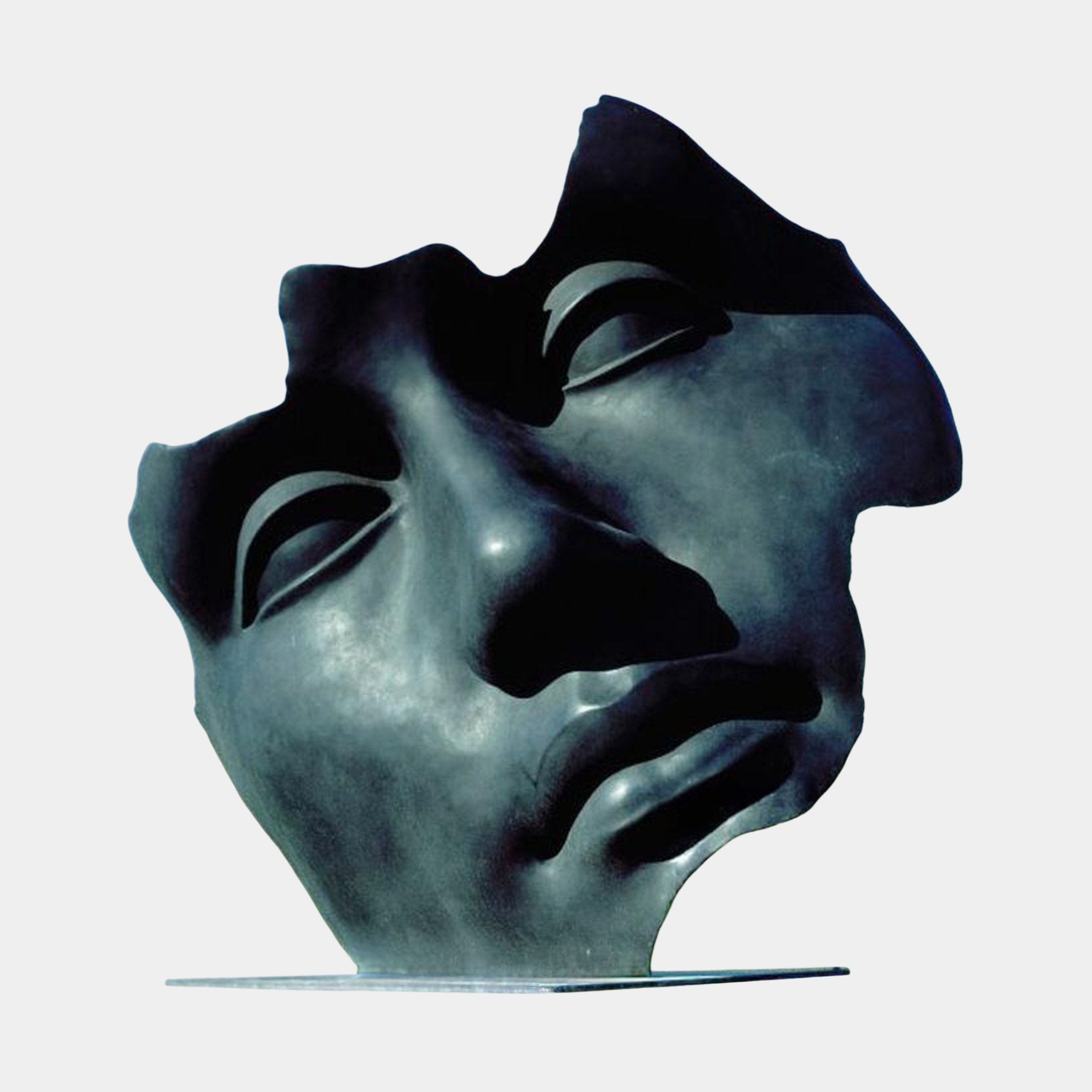 Monumental Contemporary Abstract Face Fragment Bronze Sculpture by Giant Sculptures, near-black patina with torn-edge mask form and closed eyes, on plain background.