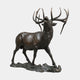 Monumental Contemporary Bugling Bull Elk Bronze Sculpture by Giant Sculptures, side view of the elk mid-call with antlers raised, on a rocky base against white.