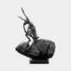 Giant Sculptures' Monumental Contemporary Contemplative Hare Bronze Sculpture in dark patina, seated atop a textured boulder in a reflective pose, on a plain background.