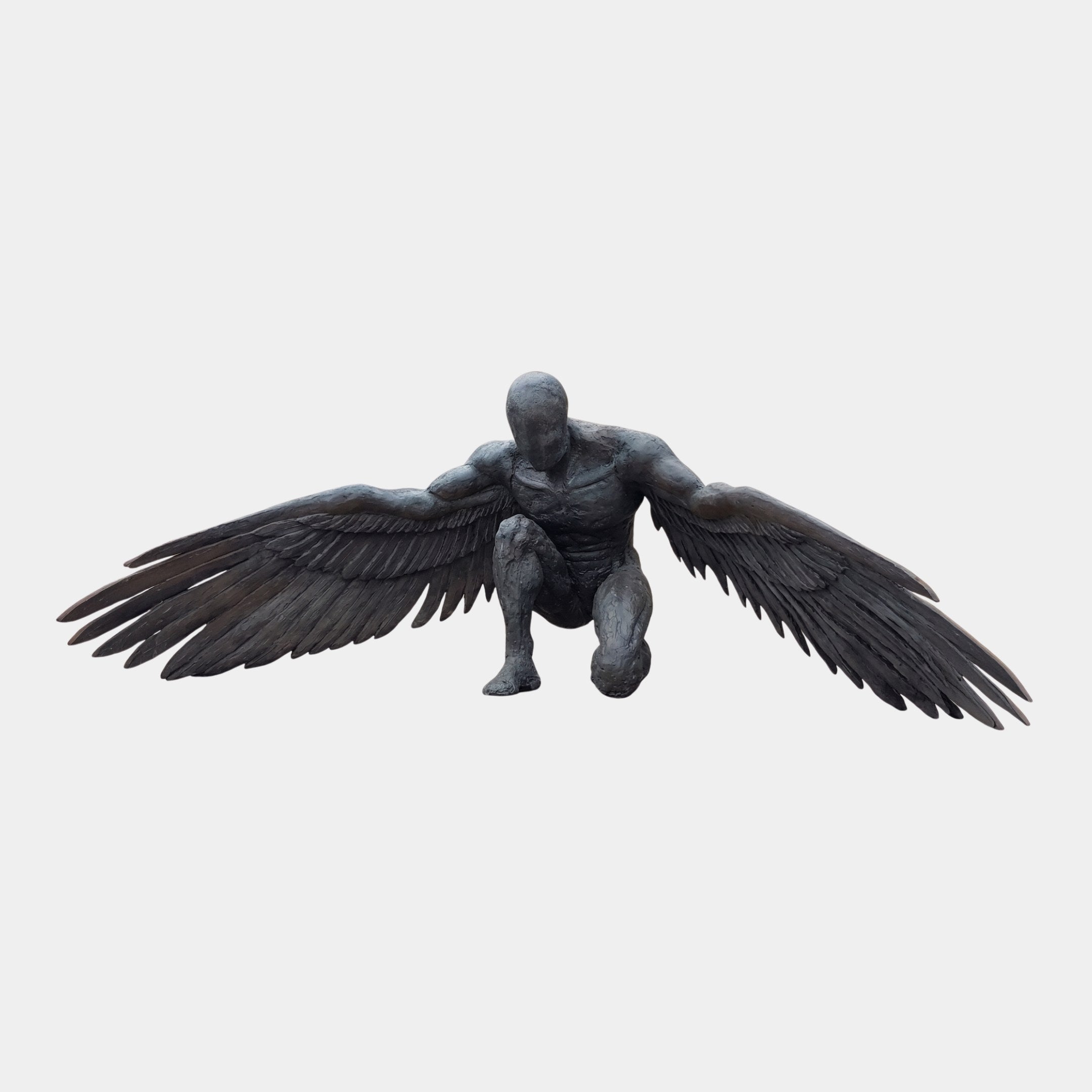 Monumental Contemporary Crouching Winged Male Bronze Sculpture by Giant Sculptures, dark patina figure crouching with wings fully outstretched, on plain background.