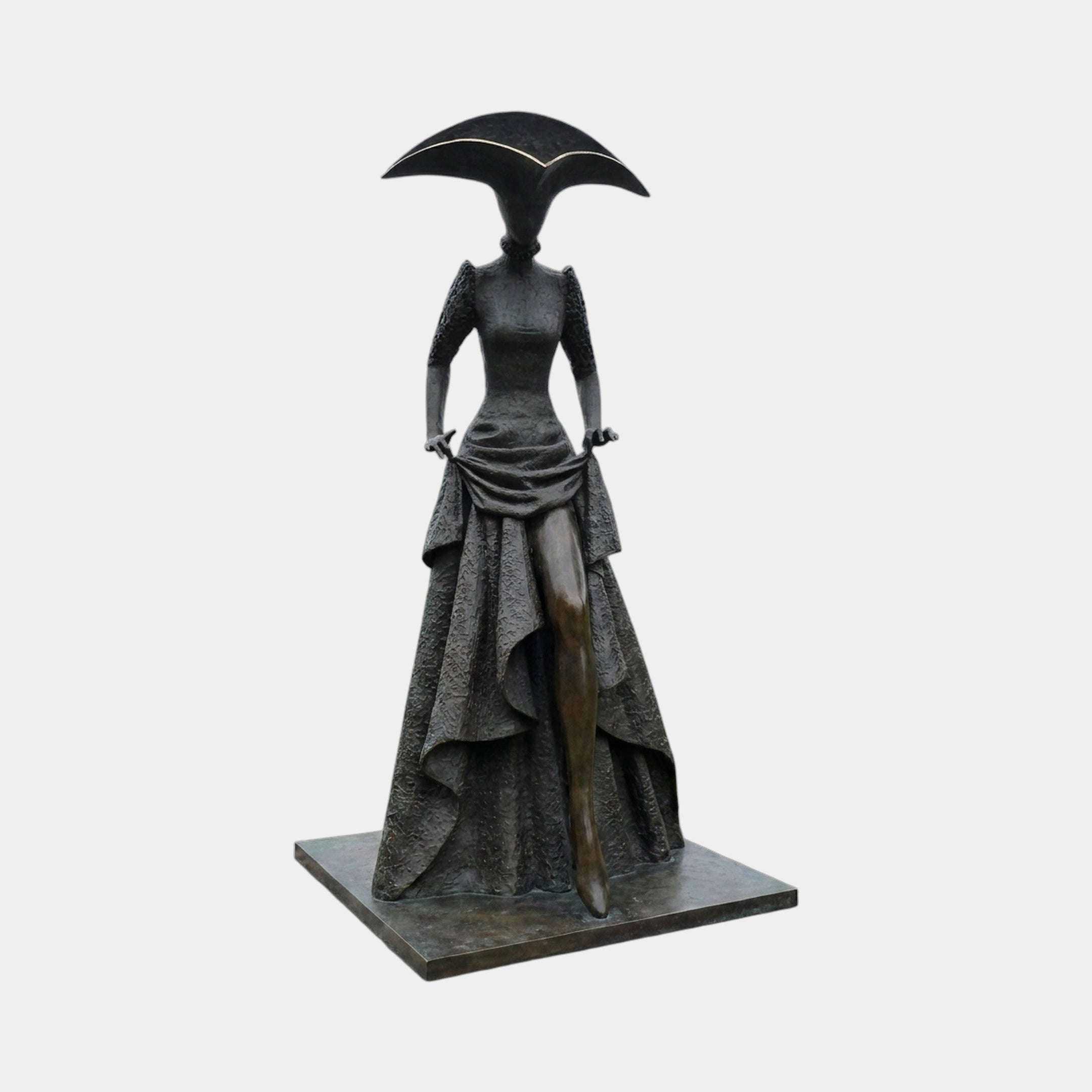 Monumental Contemporary Elongated Female Figure Bronze Sculpture by Giant Sculptures, dark patina figure in layered gown and crescent hat with gold trim.