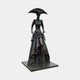 Monumental Contemporary Elongated Female Figure Bronze Sculpture by Giant Sculptures, dark patina figure in layered gown and crescent hat with gold trim.